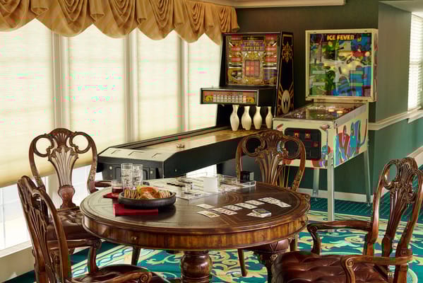 Common area with gaming tables and entertainment machines