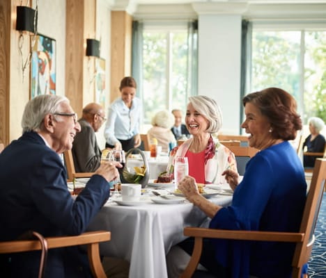 Residents enjoying a meal in the dining room