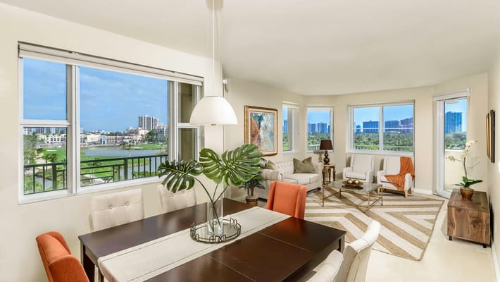 Bright common area with dining table and seating