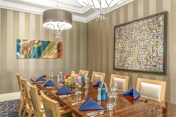 Elegant dining room setup with a long table and decor