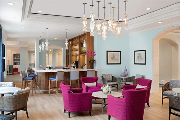 Bright common area with modern furniture and bar