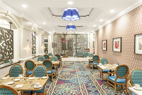 Elegant dining room with decorative chairs and tables