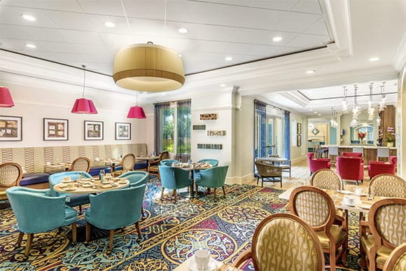 Dining area with colorful chairs and tables