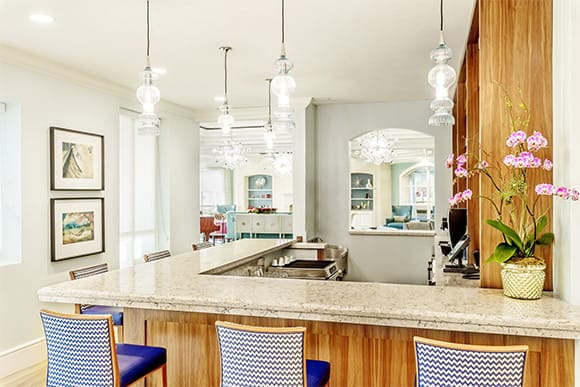 Bright, inviting interior space with a bar and seating