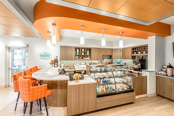 Bright dining area with a café style counter and seating