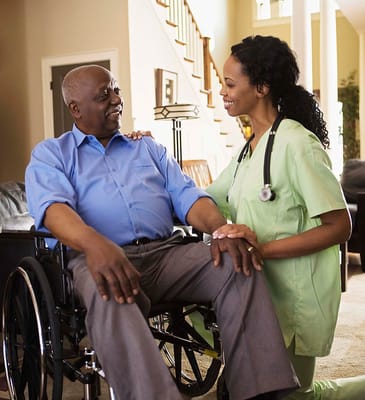 A caregiver interacting with a resident in a living area