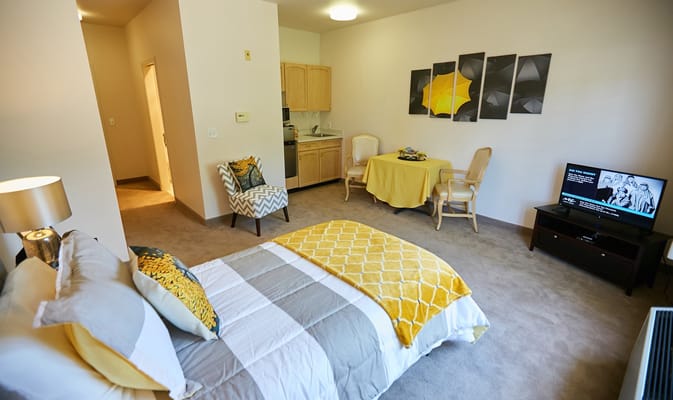 A cozy resident room with modern decor and furnishings