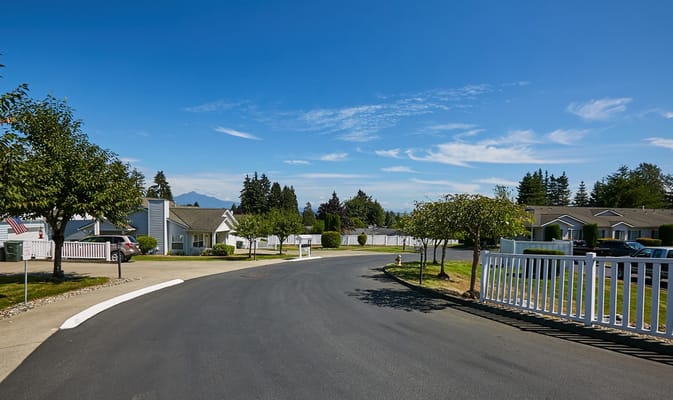 A sunny view of a residential street in a senior living community