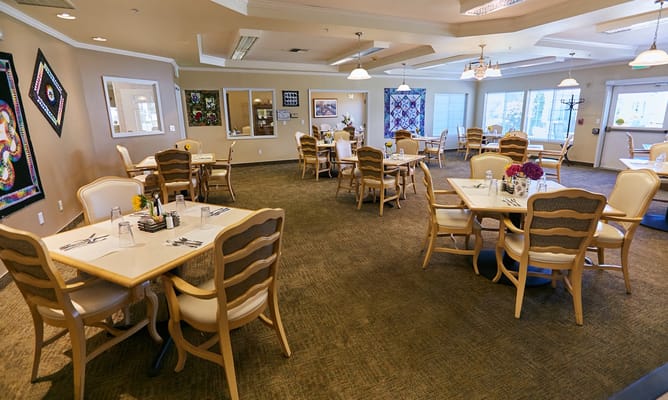 Bright dining area with tables and chairs