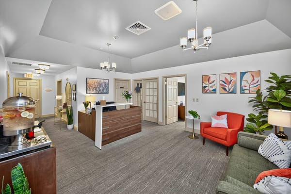 Bright lobby area with seating and reception desk