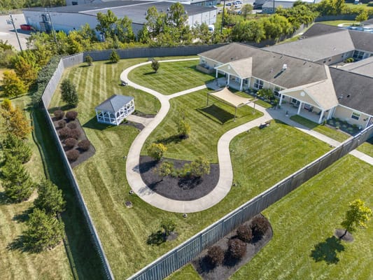 Aerial view of landscaped outdoor space in a senior living facility