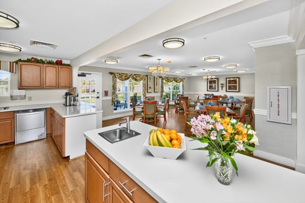 Bright, inviting dining area with flowers and fruit