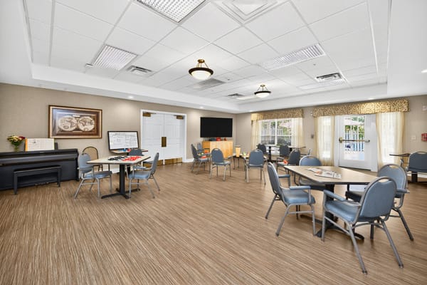Bright common area with tables and chairs