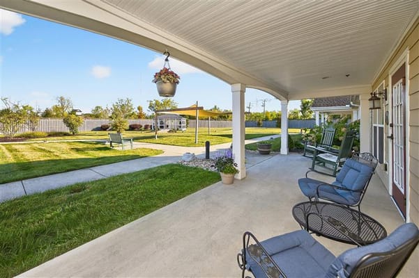 Outdoor patio area with seating and landscaping