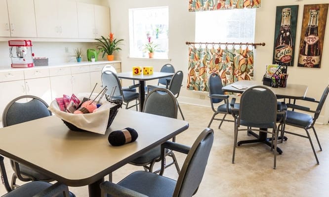 Bright common area with tables and chairs