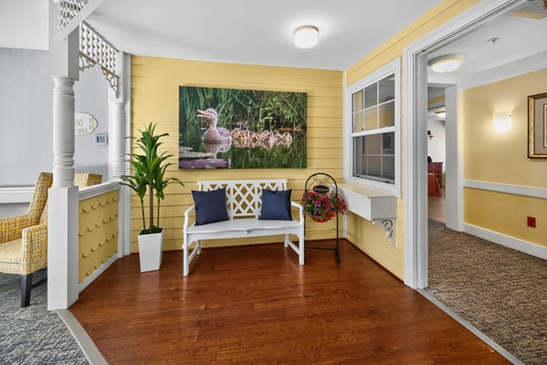 Interior seating area with a nature-themed wall art
