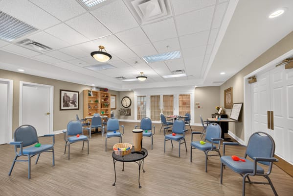 Common area with blue chairs and wooden accents