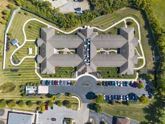Aerial view of Artis Senior Living facility with landscaped grounds