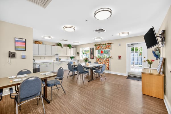 Bright dining area with tables and chairs