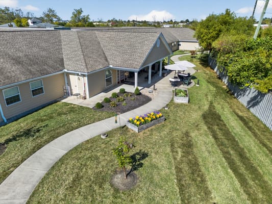 Aerial view of a senior living facility with outdoor space