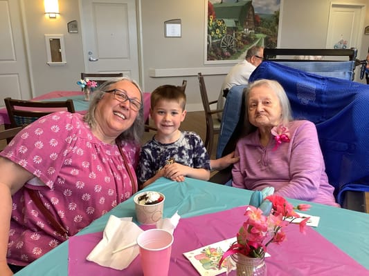 Residents and a child enjoying ice cream together