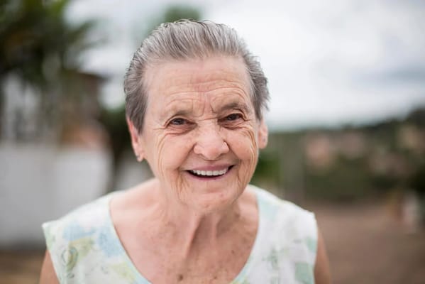 Smiling elderly woman outdoors