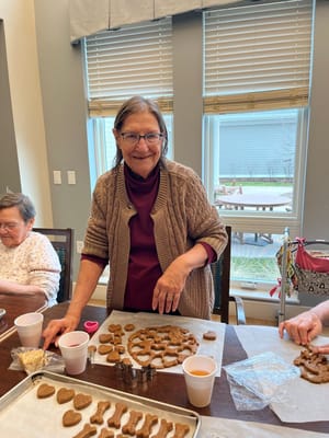 Resident baking cookies in a common area