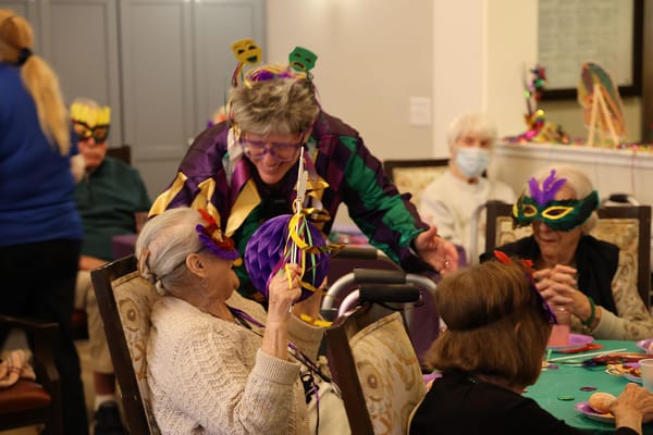 Residents enjoying a festive celebration with staff.