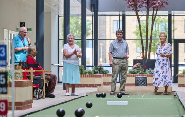 Residents enjoying a game in a common area