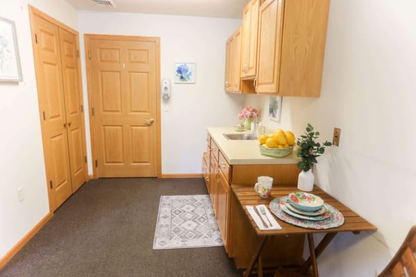 Bright kitchen area with fruits arranged neatly