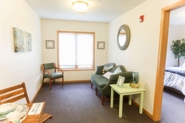 Cozy resident room with seating and decorative elements