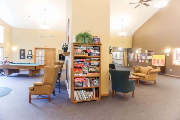 Common area with seating and bookshelves