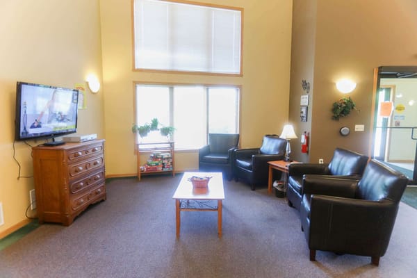 Cozy common area with seating and a TV