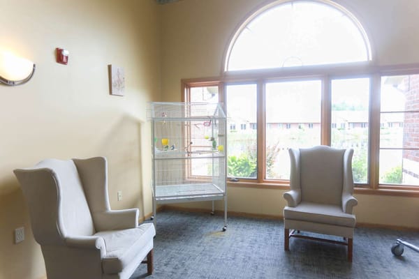 Bright seating area with large windows in the facility