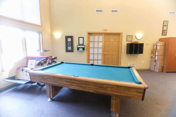 Interior view of a game room with a pool table