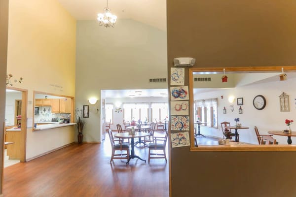 Interior view of a dining area with tables and chairs