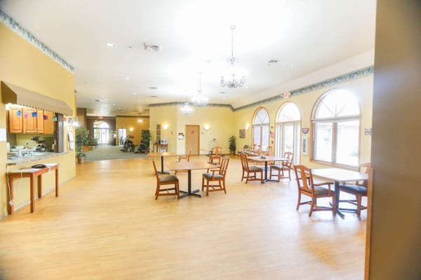 Bright dining area with tables and chairs