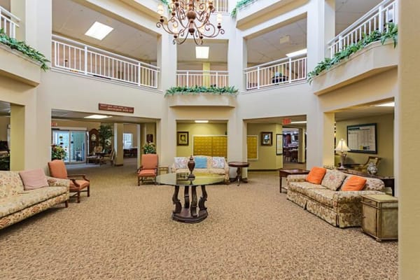 Bright common area with seating and decorative plants