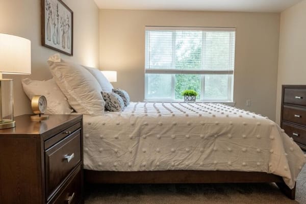 Cozy private room with a bed and window natural light