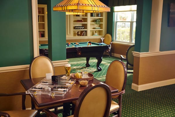 A well-furnished game room with a pool table