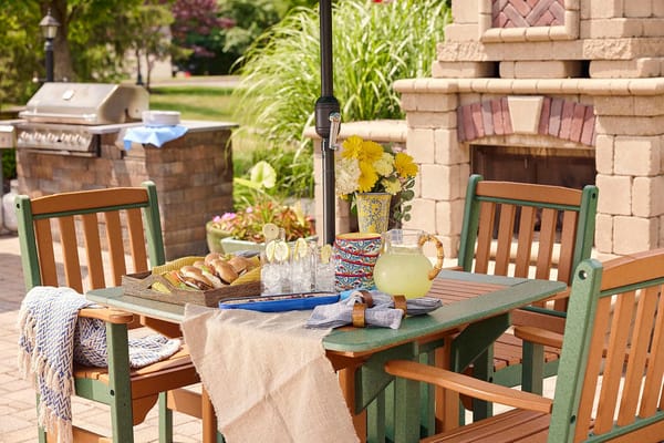 Outdoor dining setup with refreshments and snacks