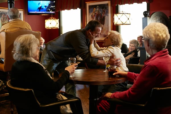 Residents enjoying a lively gathering in a common area