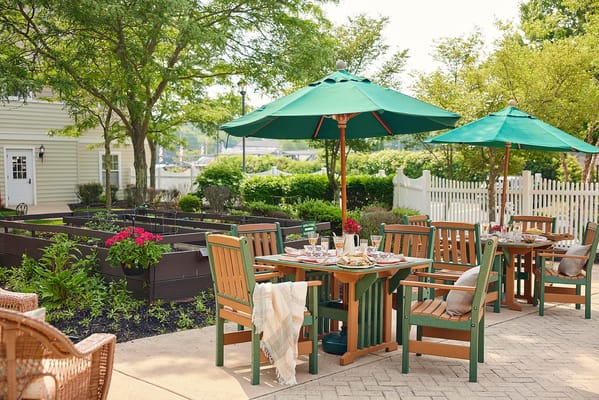Outdoor dining area with tables and umbrellas