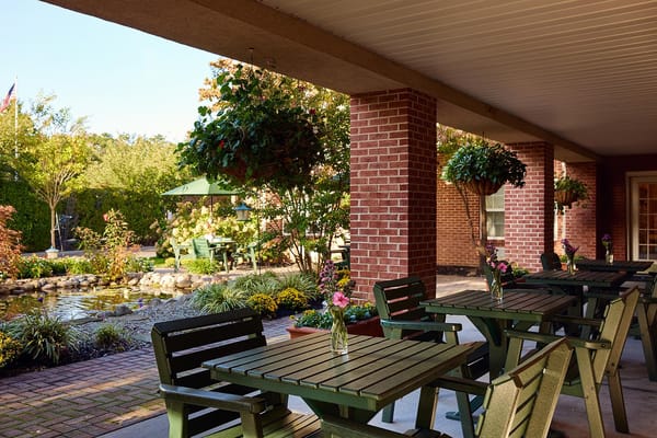 Outdoor patio area with seating and hanging plants