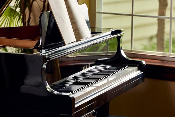 Close-up of a grand piano with sheet music