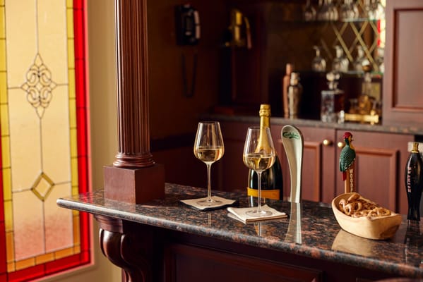 Elegant interior bar setup with wine and snacks