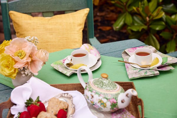 Tea setting with flowers in an outdoor space
