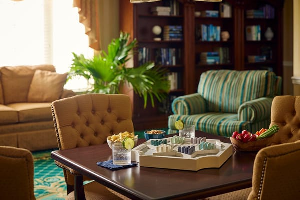A cozy common area with drinks and snacks on a table