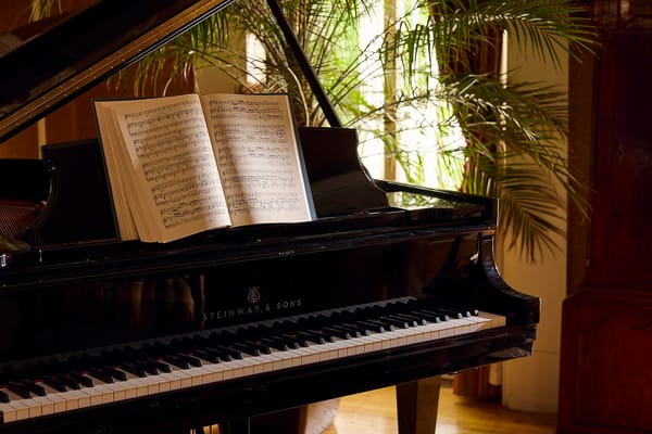 Close-up of a grand piano with sheet music