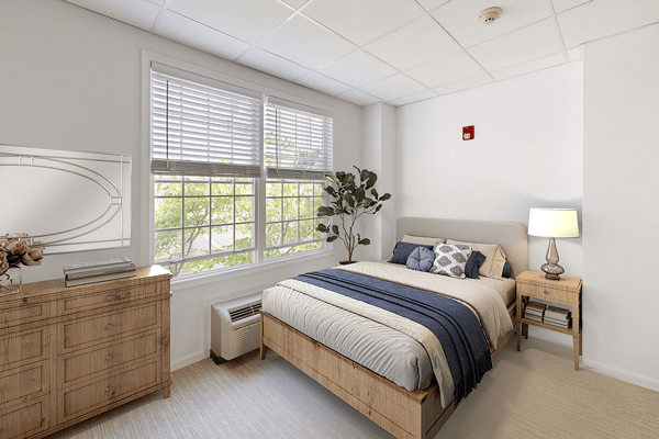 Cozy bedroom with natural light and modern furnishings